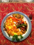 Egg crepe omelet with vegetables and cheese